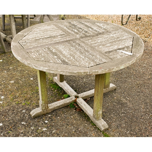 2 - A weathered Lister teak circular garden table, 165 cm dia. to/w a set of four Lister teak reclining ... 