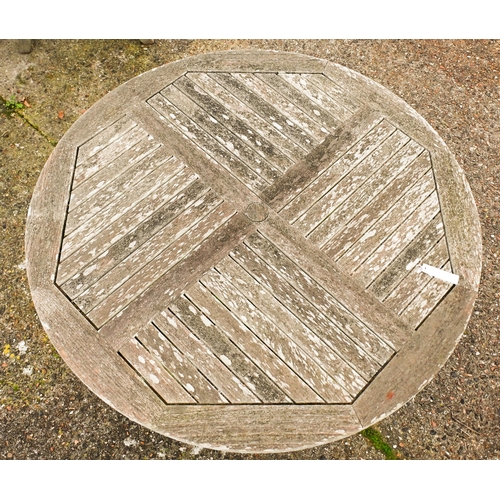 2 - A weathered Lister teak circular garden table, 165 cm dia. to/w a set of four Lister teak reclining ... 