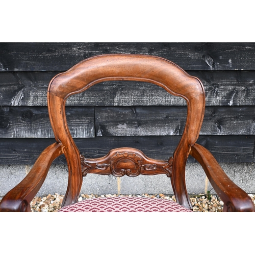 148 - A set of eight walnut framed dining chairs, the overstuffed fabric seats on cabriole front legs, 6 s... 