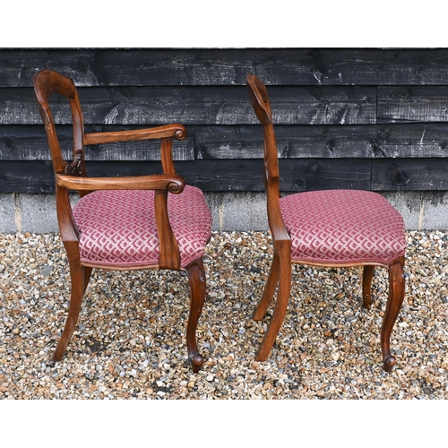 148 - A set of eight walnut framed dining chairs, the overstuffed fabric seats on cabriole front legs, 6 s... 