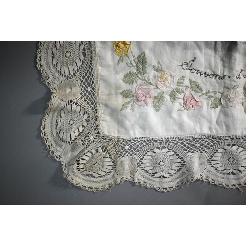 290 - A World War I North France souvenir silk shawl, with crochet edging and applied roses and featuring ... 