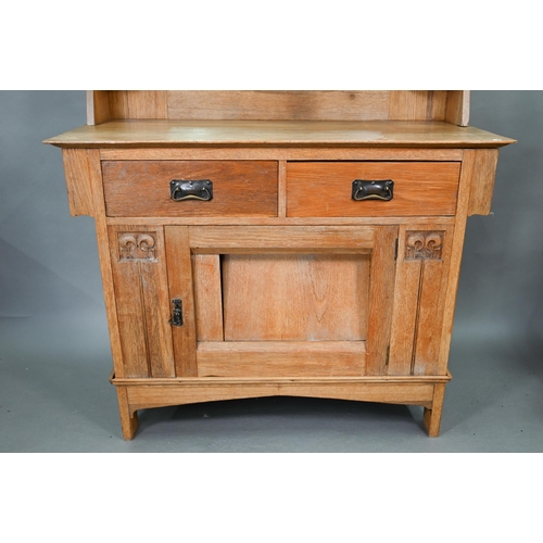 216 - An early 20th century Arts & Crafts mirror backed oak sideboard, the bevel edged plate flanked b... 