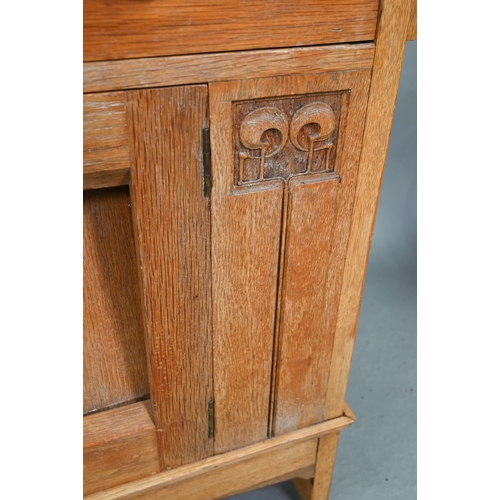 216 - An early 20th century Arts & Crafts mirror backed oak sideboard, the bevel edged plate flanked b... 