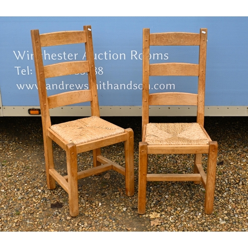 61 - # A set of six modern beech ladderback dining chairs with rush seats (6)