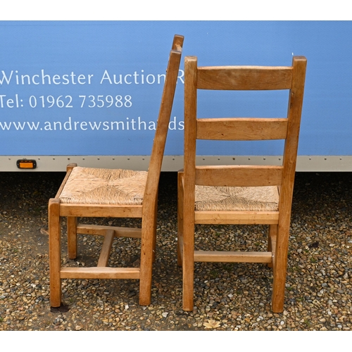 61 - # A set of six modern beech ladderback dining chairs with rush seats (6)