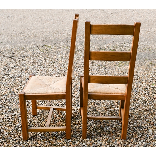 224 - Fired earth, an oak block top kitchen table, 148 cm x 90 cm x 78 cm h to/w a conforming set of eight... 