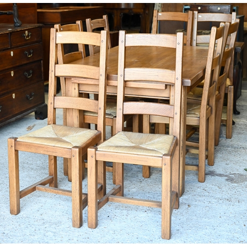 224 - Fired earth, an oak block top kitchen table, 148 cm x 90 cm x 78 cm h to/w a conforming set of eight... 