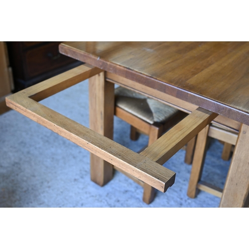 224 - Fired earth, an oak block top kitchen table, 148 cm x 90 cm x 78 cm h to/w a conforming set of eight... 