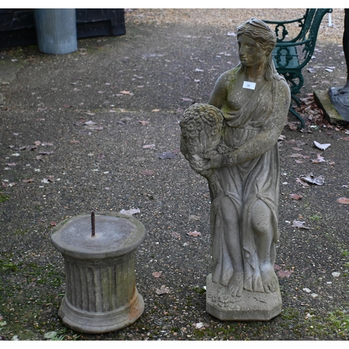 10 - A weathered cast stone garden statue on a plinth base