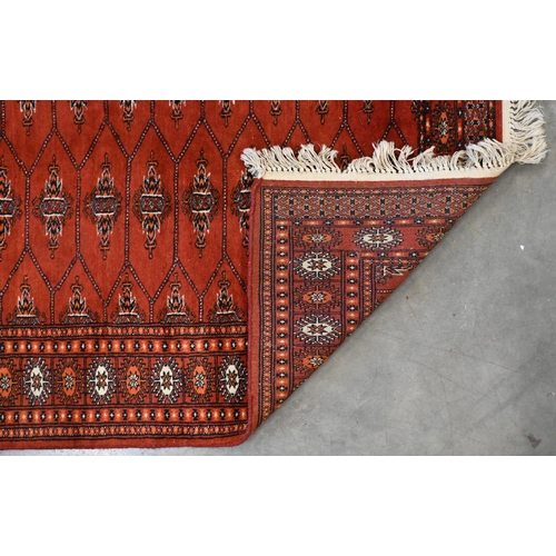 127 - A Pakistani Turkoman design red ground runner, 244 x 84 cm