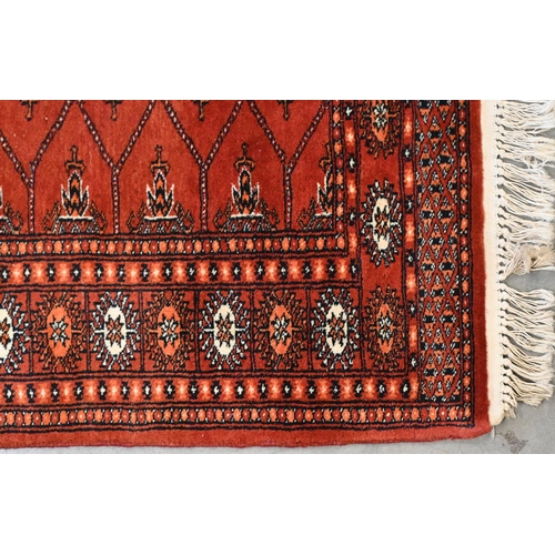 127 - A Pakistani Turkoman design red ground runner, 244 x 84 cm