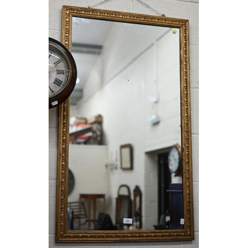 129 - A rectangular wall mirror in giltwood egg and dart frame pattern frame, 104 x 62 cm