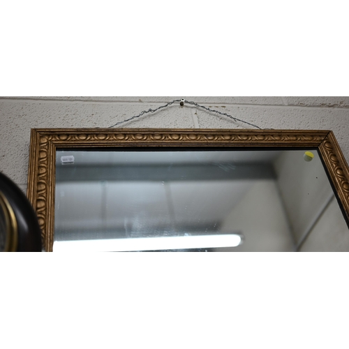 129 - A rectangular wall mirror in giltwood egg and dart frame pattern frame, 104 x 62 cm