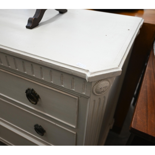 130 - A painted Chelsea Design Company chest of three long drawers with fluted mouldings and supports, 112... 