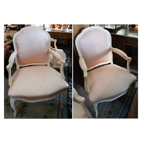 131 - A pair of French painted fauteuil open armchairs with patterned pink fabric