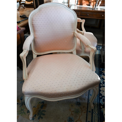 131 - A pair of French painted fauteuil open armchairs with patterned pink fabric