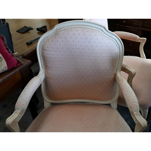 131 - A pair of French painted fauteuil open armchairs with patterned pink fabric