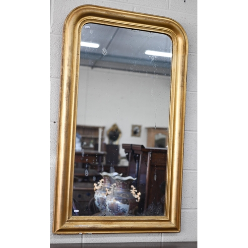 134 - An antique arched wall mirror in re-finished gilt gesso and wood moulded frame, 70 x 120 cm