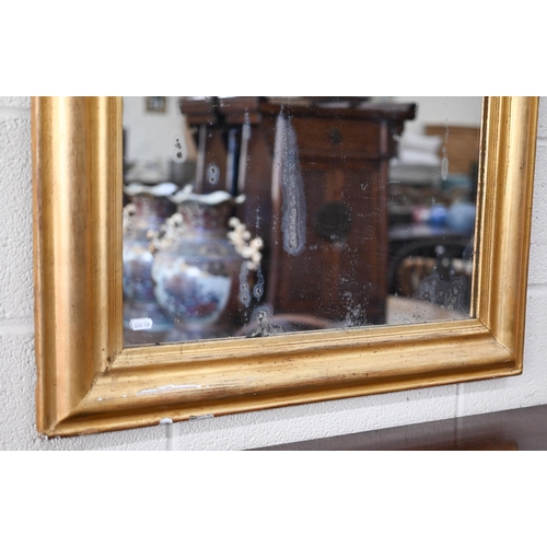 134 - An antique arched wall mirror in re-finished gilt gesso and wood moulded frame, 70 x 120 cm