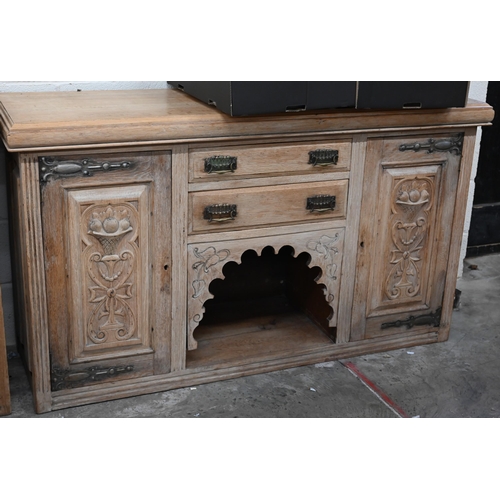 137 - An Art Nouveau light oak sideboard with two central drawers with carved cupboard doors each side 154... 