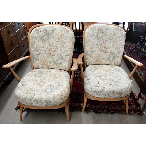 138 - Three mid century Ercol (blue label) beech framed 'Windsor' easy chairs with floral back and seat cu... 