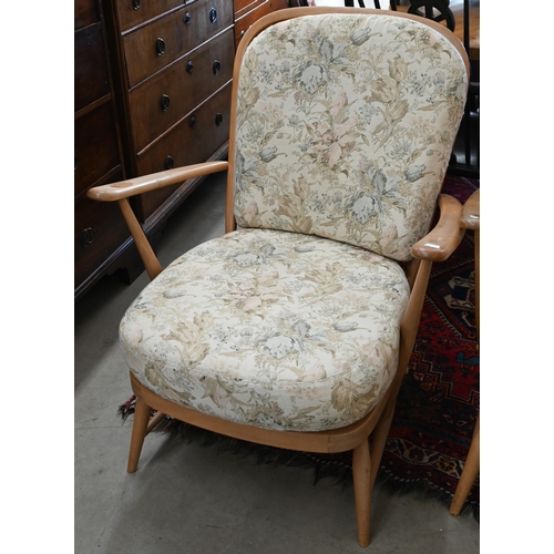 138 - Three mid century Ercol (blue label) beech framed 'Windsor' easy chairs with floral back and seat cu... 