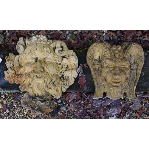 14 - Four assorted cast stone garden 'Green man' wall mask plaques (4)