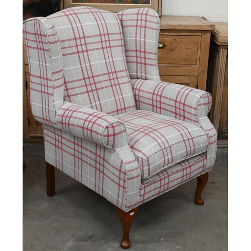 140 - A Georgian style wingback armchair with checked fabric and cabriole front legs