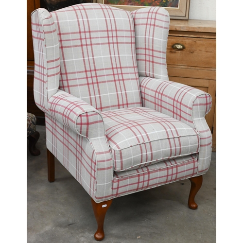 140 - A Georgian style wingback armchair with checked fabric and cabriole front legs