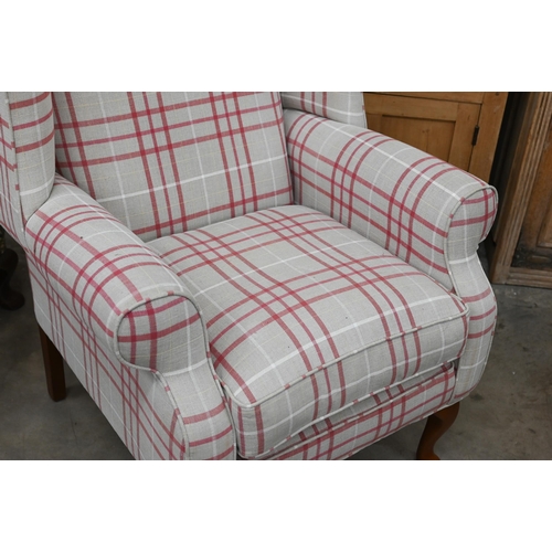 140 - A Georgian style wingback armchair with checked fabric and cabriole front legs