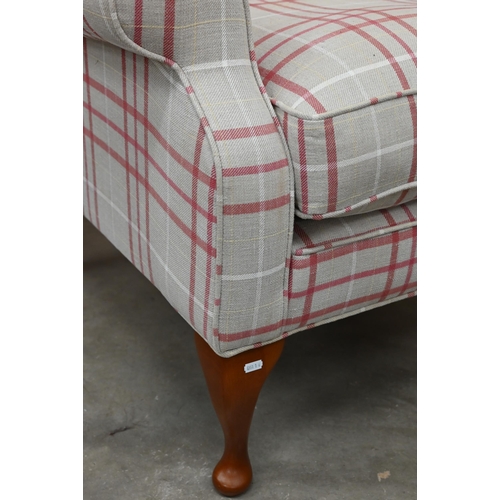 140 - A Georgian style wingback armchair with checked fabric and cabriole front legs