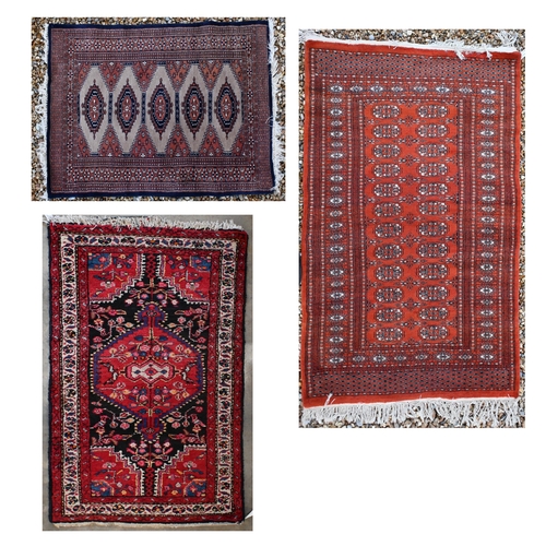 142 - Two Pakistani Turkoman design rugs, red and beige ground with repeating geometric guls, 152 x 94 cm ... 