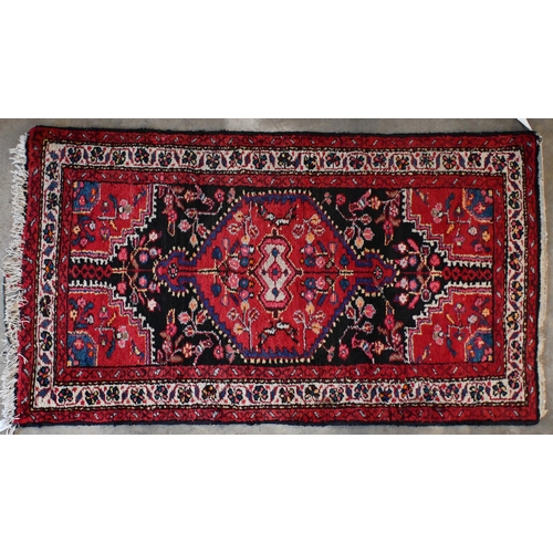 142 - Two Pakistani Turkoman design rugs, red and beige ground with repeating geometric guls, 152 x 94 cm ... 