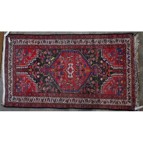 142 - Two Pakistani Turkoman design rugs, red and beige ground with repeating geometric guls, 152 x 94 cm ... 