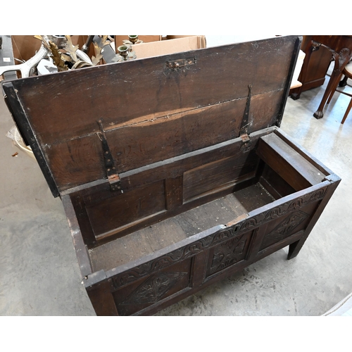 146 - A small antique oak coffer, traditional panelled construction with carved front and hingd top, 106 x... 