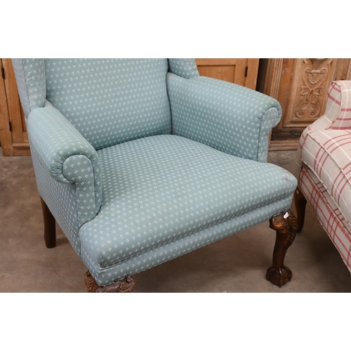 151 - A Georgian style wingback armchair, patterned teal upholstery and carved cabriole front legs with ba... 