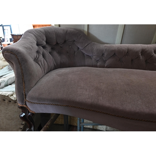 154 - A Victorian mahogany famed salon settee upholstered in brown button back fabric, shaped front legs w... 