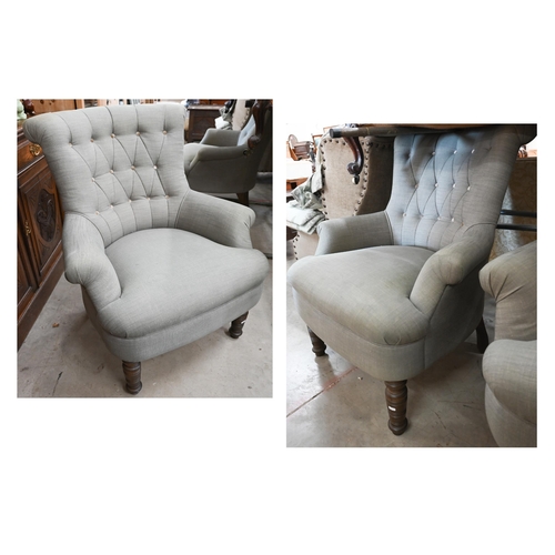 155 - A pair of modern button back armchairs in grey fabric with turned front legs (a/f)