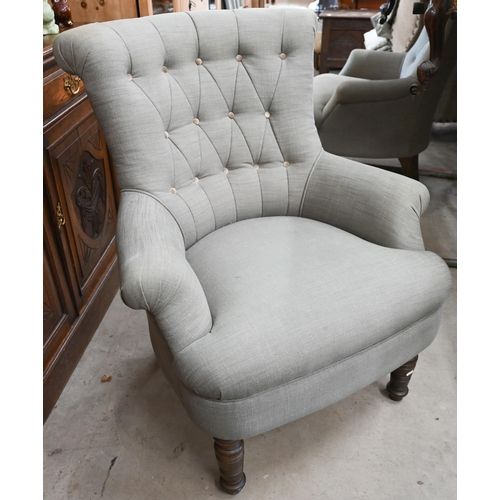 155 - A pair of modern button back armchairs in grey fabric with turned front legs (a/f)