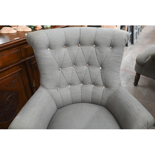 155 - A pair of modern button back armchairs in grey fabric with turned front legs (a/f)