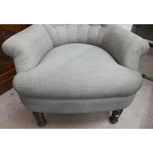 155 - A pair of modern button back armchairs in grey fabric with turned front legs (a/f)