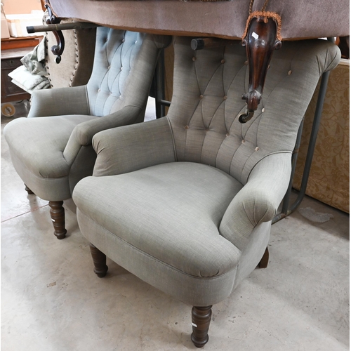 155 - A pair of modern button back armchairs in grey fabric with turned front legs (a/f)