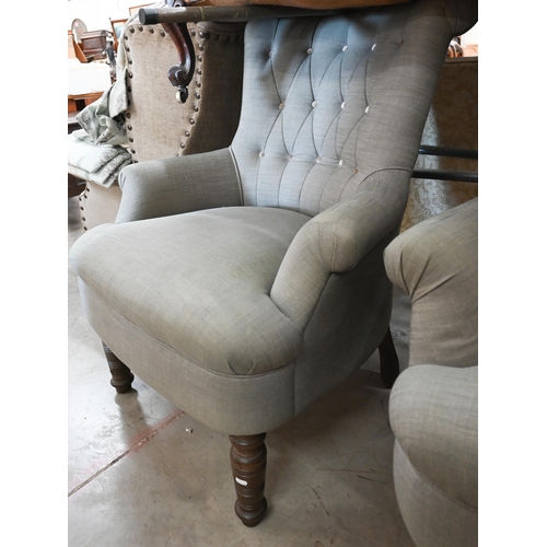 155 - A pair of modern button back armchairs in grey fabric with turned front legs (a/f)