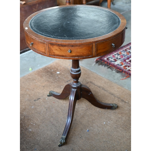 163 - A reproduction mahogany drum table with tooled leather top and tripod base, 58 cm diam x 72 cm high