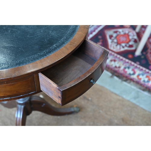 163 - A reproduction mahogany drum table with tooled leather top and tripod base, 58 cm diam x 72 cm high