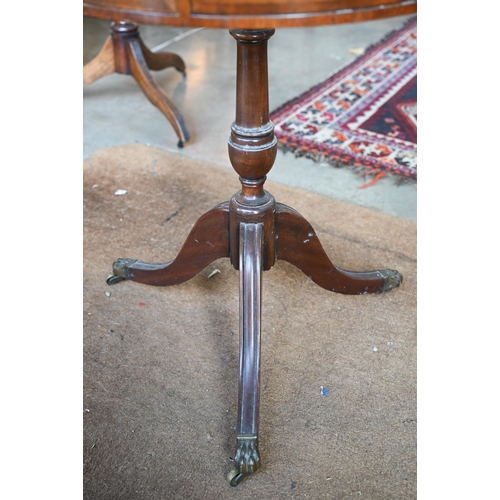 163 - A reproduction mahogany drum table with tooled leather top and tripod base, 58 cm diam x 72 cm high