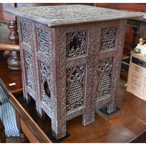 167 - A late 19th century Anglo-Indian carved hardwood table on pierced folding base, 45 x 45 x 50 cm high... 