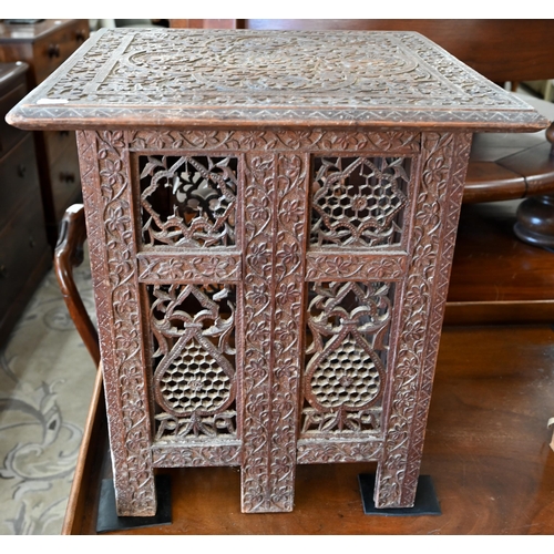 167 - A late 19th century Anglo-Indian carved hardwood table on pierced folding base, 45 x 45 x 50 cm high... 