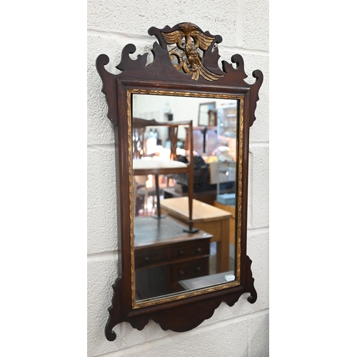 169 - A wall mirror in fret-cut mahogany frame surmounted by gilt ho-ho bird (a/f), 70 x 40 cm