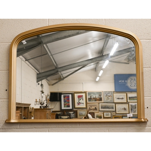 174 - A modern arched over mantel in moulded gilt frame, 106 x 75 cm